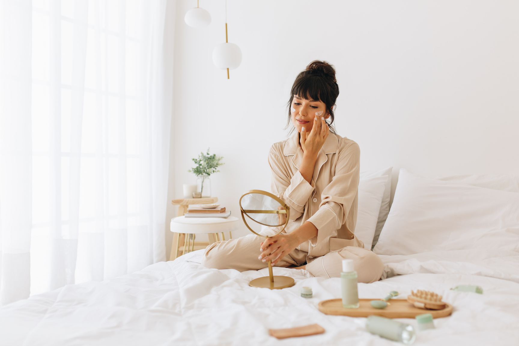 Woman doing self care applying beauty cosmetics